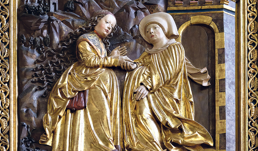 Zwei schwangere Frauen und zwei ungeborene Kinder: Maria besucht Elisabeth. Detail des Marienaltars in der Pfarrkirche Hallstatt. 