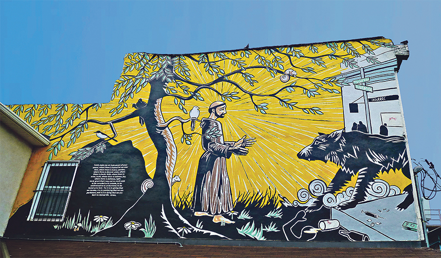 In Philadelphia in den USA hat sich ein zeitgenössischer Muralkünstler von Franz von Assisi und dem Wolf von Gubbio inspirieren lassen und davon ein großes Wandbild gemalt.  