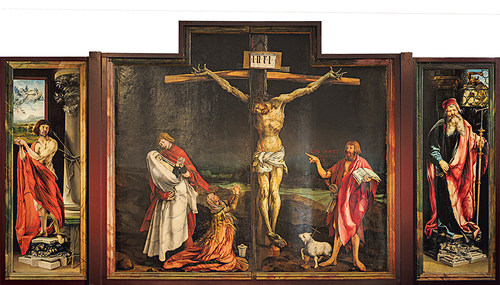 Johannes verweist mit dem langen Finger auf den Gekreuzigten. 