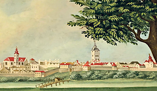 Die Zunftfahne der Zimmerer zeigt eine Ansicht der Stadt Enns. Der Stadtturm aus der Zeit der Renaissance ist das unverkennbare Merkmal der Stadt. 