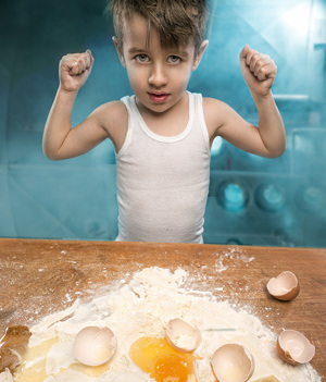 Little chefs enjoying in the kitchen making big mess